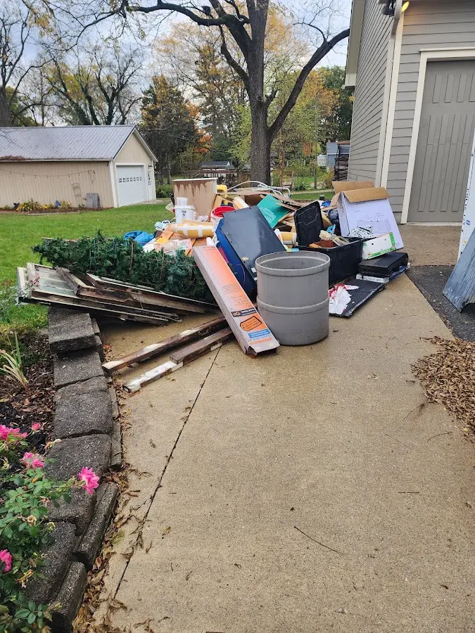 Dumpster being loaded with debris for Roofing Dumpster Rental in Parker